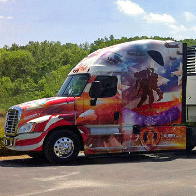 The front of a veterans-themed semi Purdy Bros truck